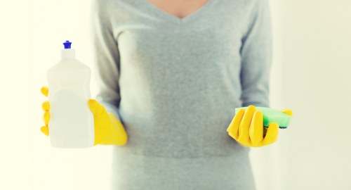 Checklist and cleaning supplies for choosing home cleaners in NW1