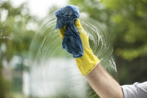 Cleaning team in NW1 performing thorough domestic cleaning in a bright living room