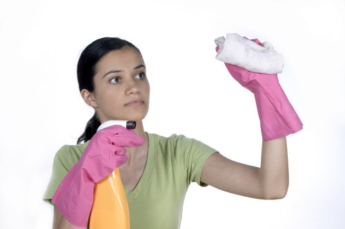 Cleaner using careful methods to avoid slips and chemical exposure